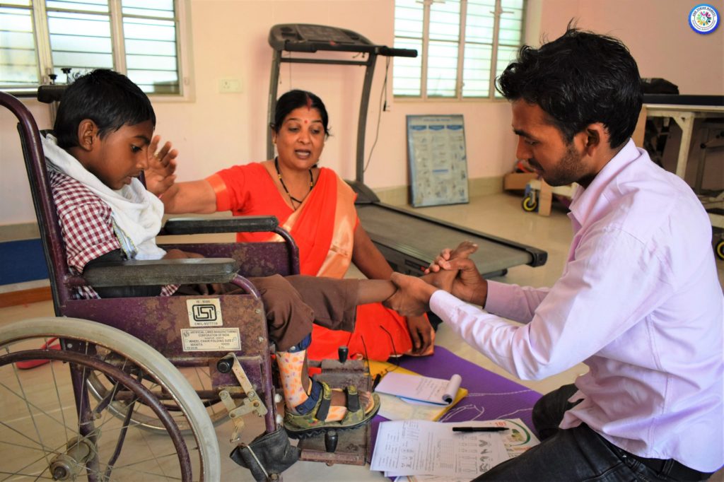 A CBR worker screening a Child with Disability (CwD)